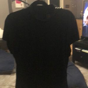 Black blouse. Pleating on sides